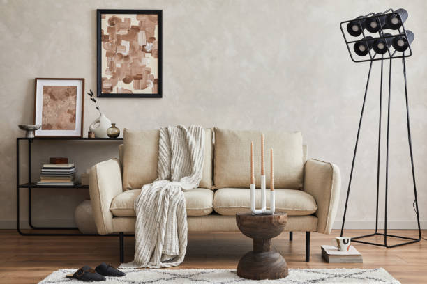 istock Modern composition of elegant living room interior design with mock up poster frame, sofa, console, coffee table and stylish personal accessories. Copy space. Template. 