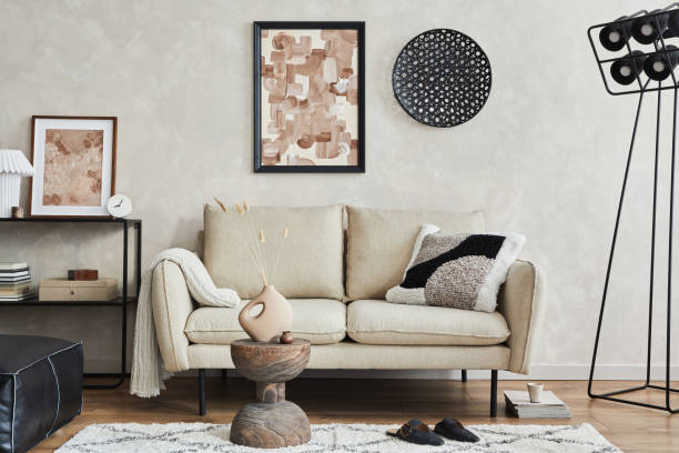 istock Modern elegnat living room interior design with sofa, console, mock up poster frame, lamp and stylish personal accessories. Copy space. Template.