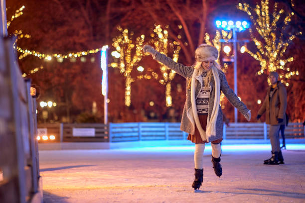 istock Happy female ice skating alone; Winter joy concept 1360169127