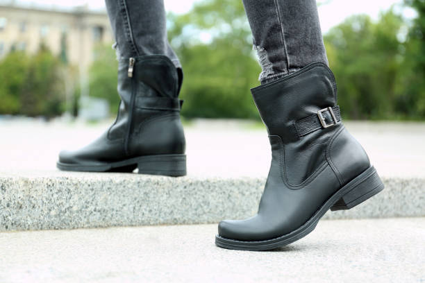 istock Woman wearing comfortable stylish boots outdoors, closeup 1360169278