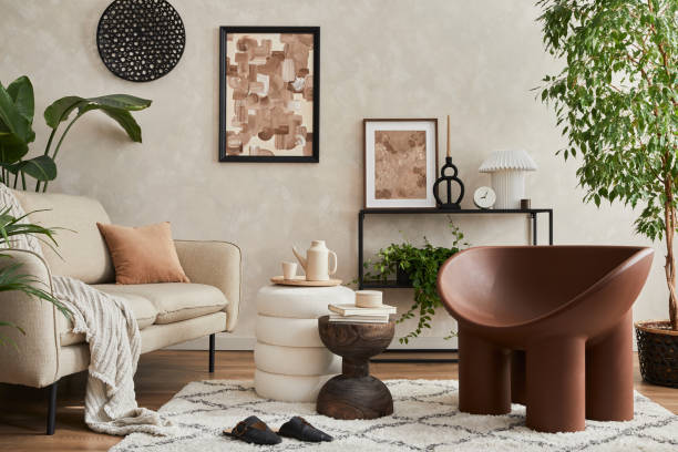 istock Modern composition of elegant living room interior design with mock up poster frame, sofa, armchair, pouf, console, coffee table, plants and stylish personal accessories. Copy space. Template. 1360170116