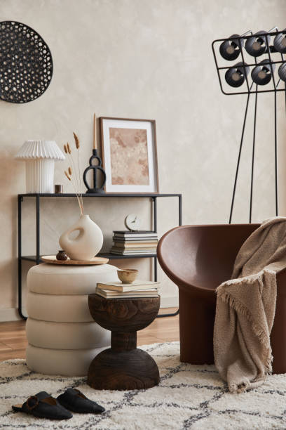 istock Modern elegnat living room interior design with creative armchair, console, mock up poster frame, lamp and stylish personal accessories. Copy space. Template. 1360170130