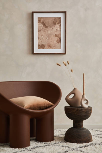 istock Elegant living room minimalist interior composition with creative armchair, coffee table, mock up poster frame and creative design personal accessories. Copy space. Template. 1360170140