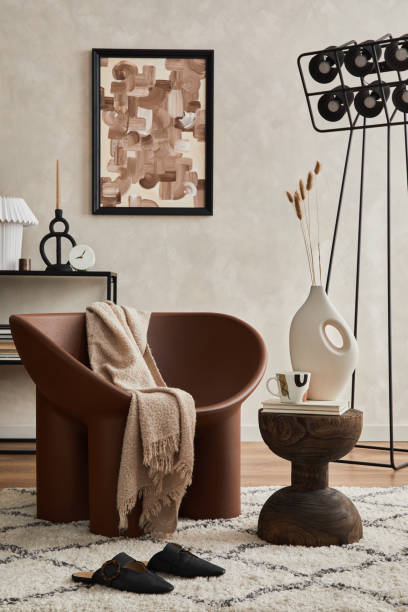 istock Modern elegnat living room interior design with creative armchair, console, mock up poster frame, lamp and stylish personal accessories. Copy space. Template. 1360170188