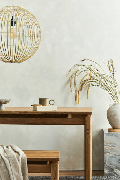 istock Elegant dining room interior composition with wooden dining table, bench and design home deocrations and personal accessories. Modern home staging. Wabi sabi inspiration. Template. 