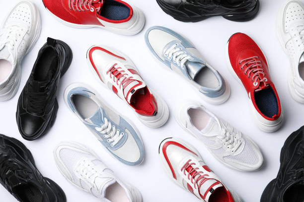 istock Many stylish sneakers on white background, top view 1360173955