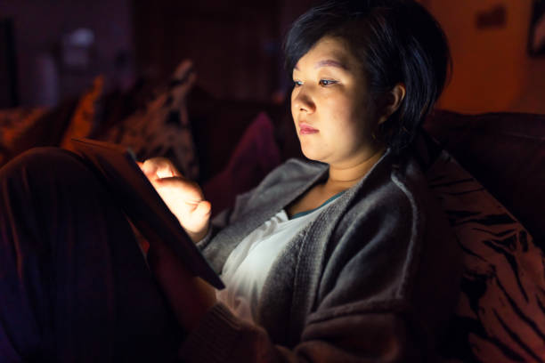 istock Asian woman using Laptop in home 1360175783