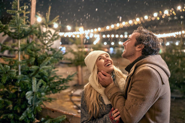 istock Couple choose the perfect Christmas tree 1360175871