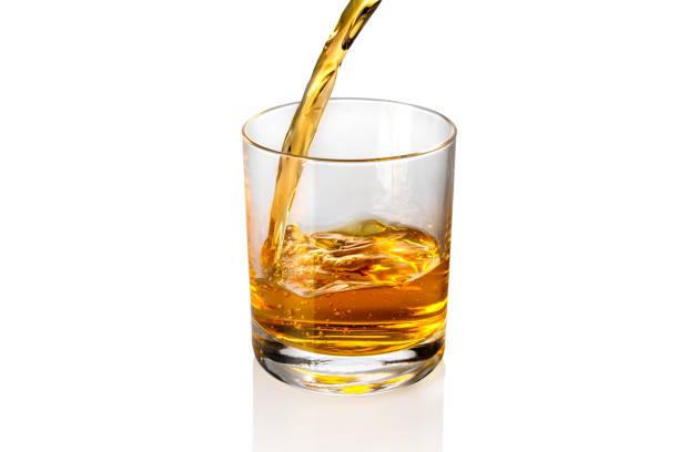 istock Whisky pouring into glass 1360178103