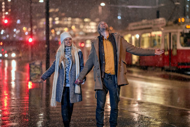 istock Joyful couple walking together; Christmas joy concept 1360182947