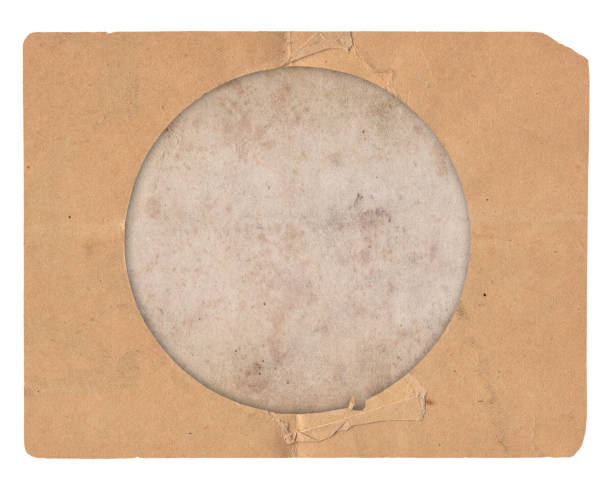 istock Old photo vintage texture with stains, scratches and round window 1360186904