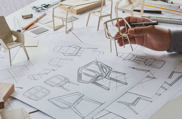 istock Designer sketching drawing design development product plan draft chair armchair Wingback Interior furniture prototype manufacturing production. designer studio concept . 1360186968