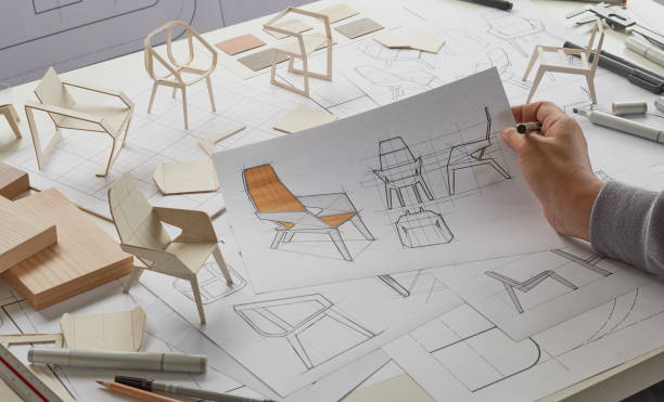 istock Designer sketching drawing design development product plan draft chair armchair Wingback Interior furniture prototype manufacturing production. designer studio concept . 1360186973