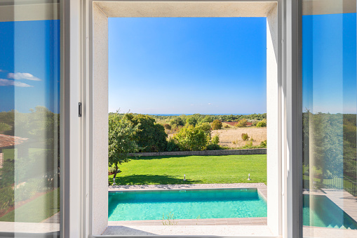 View from the window on the private swimming pool and yard, Istria, Croatia