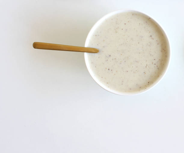 istock Refreshing milkshakes or smoothiesapple and kiwi. On a white wooden table, copy space, top view. 1360191279