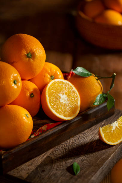 istock Fresh oranges on the wooden table 1360191685