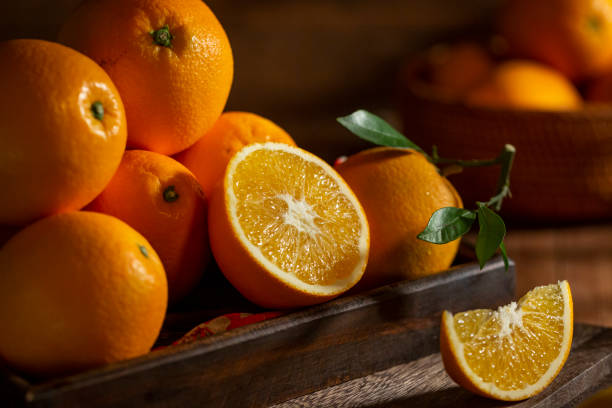 istock Fresh oranges on the wooden table 1360191717