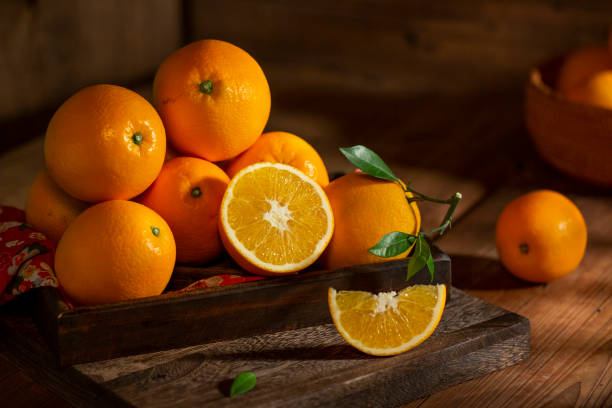 istock Fresh oranges on the wooden table 1360192289