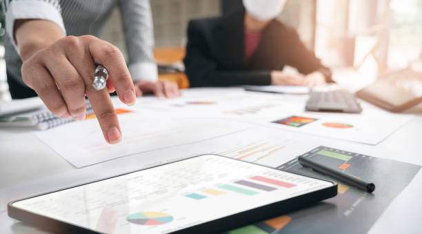 istock Business person using portable tablet analyzing financial and business statistic. 1360193818