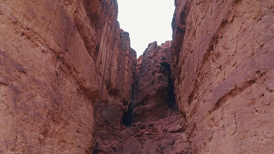 View on narrow gorge between high stone cliff walls