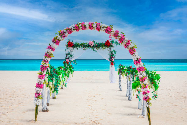 istock Wedding gate with floral decorations on a beach on the Maldives 1360195185