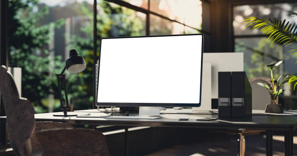 istock Computer all-in-one with a blank screen front in industrial loft green ecological office interior 1360195360