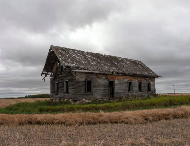 istock Abandoned wooden church in an empty field. 1360195503