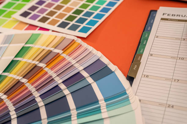 istock on a monochrome background color palettes, samples and near them the notebook 1360196285