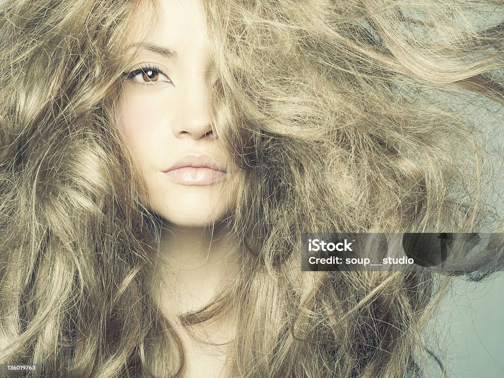 Close-up of woman with long, wavy, blonde hair Photo of beautiful woman with magnificent hair 20-24 Years Stock Photo