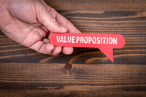 istock Value Proposition. Red speech bubble on a wooden background 1360198866