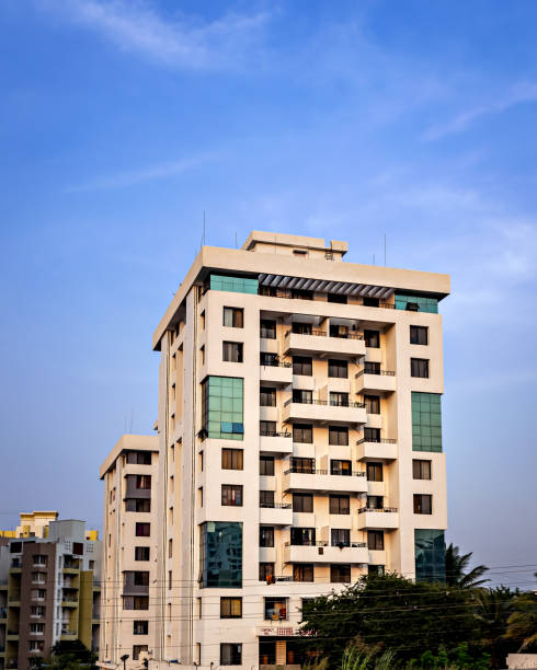 istock High rise, modern tall building with clear blue sky background. 1360198890