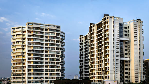 istock High rise, modern tall buildings with clear blue sky background. 1360198900