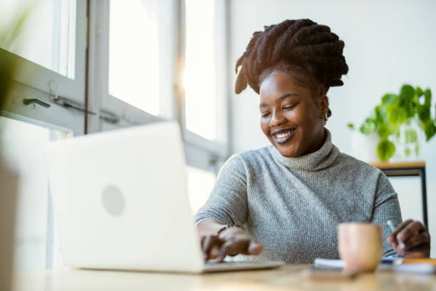 istock Woman working on laptop in her office 1360198930