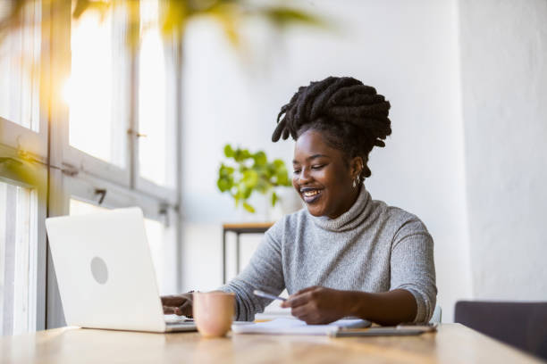 istock Woman working on laptop in her office 1360198932