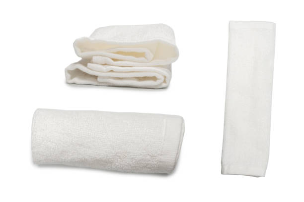 istock White fluffy cotton towel isolated on a white background. 1360199272