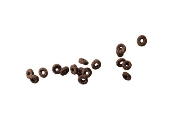 istock Chocolate rings cereal spill out into a bowl. Breakfast. 1360199313