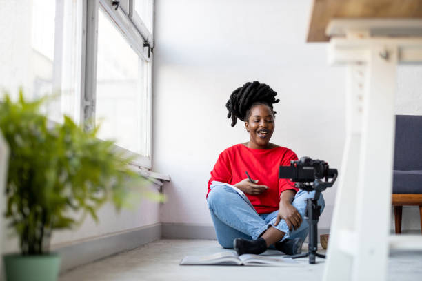 istock Female vlogger making social media video 1360199555