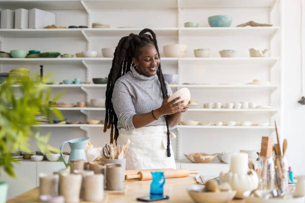 istock Woman pottery artist working in her art studio 1360200286