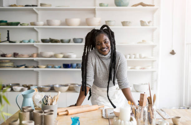 istock Confident female pottery artist in her art studio 1360200288