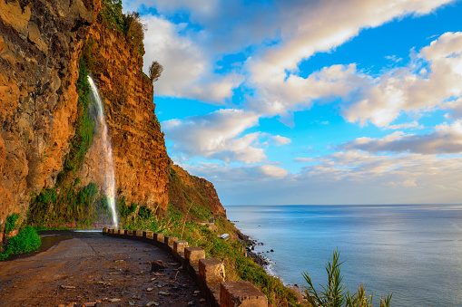 Waterfall on an old closed road between Ponta do Sol and Jardim do Mar, Madeira island, Portugal.