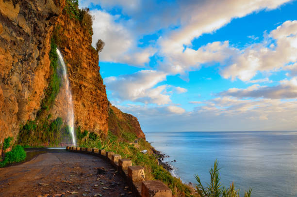 Waterfall on an old road near Ponta do Sol in Madeira Island, Portugal stock photo