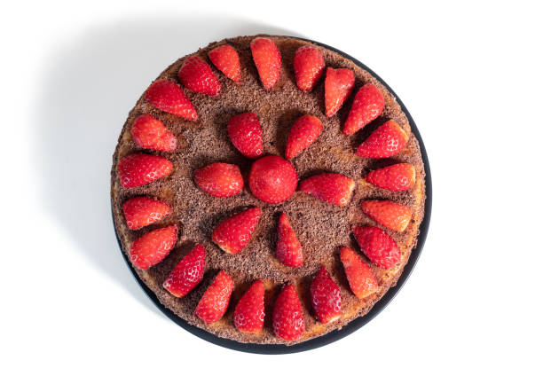 istock Handmade chocolate and strawberry cake isolated from white background, top view 1360201720