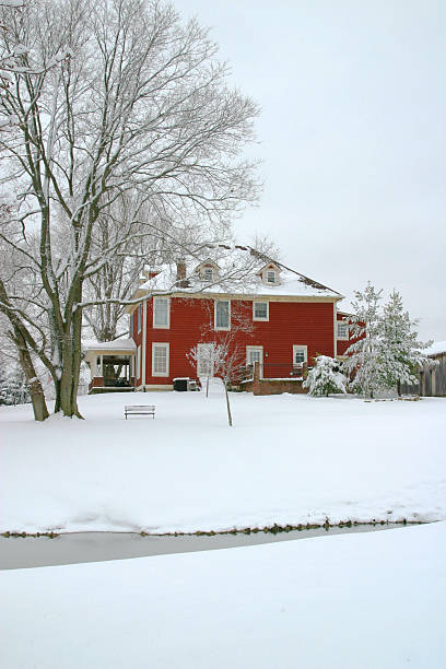 istock Red Farmhouse In The Winter Snow - Stream 136020213