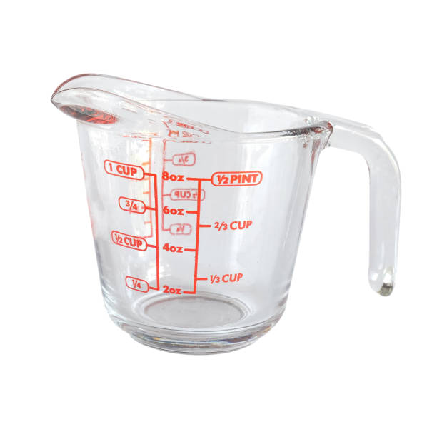 istock Glass Measuring cup on white background. 1360202674