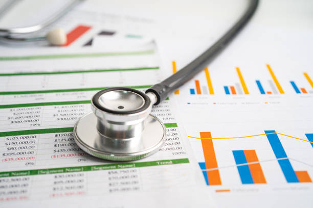 istock Stethoscope on charts and graphs paper, Finance, Account, Statistics, Investment, Analytic research data economy and Business company concept. 1360202786