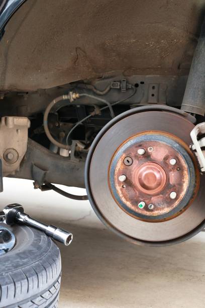 istock Car tire replacement and maintenance Jack-up brake disc 1360207118