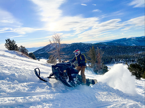 Snowmobiling and skiing in the mountains above Lake Tahoe