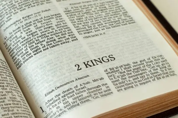 2 Kings open Holy Bible Book. A close-up. Reading and studying Old Testament Scripture. Christian biblical concept. Faith, trust, and obedience to God Jesus Christ.