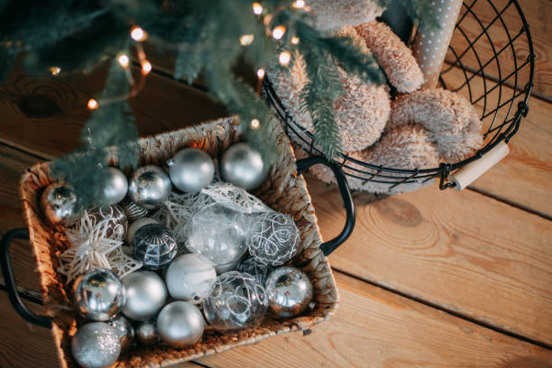 istock Wicker basket with white and silver Christmas decorations 1360209957