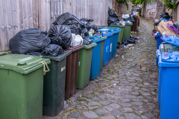 Overflowing Rubbish In A Back Alley Overflowing Rubbish (Garbage) In An Alleyway In Glasgow During A Strike Action overflowing dumpster stock pictures, royalty-free photos & images